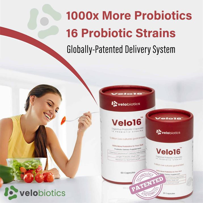 Velo16 Probiotic Capsules packaging on a table with woman eating salad; promotes digestive health and immunity with 16 probiotic strains.