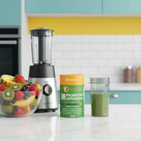 GutSlim Probiotics SuperGreens container with blender, green smoothie, and fresh fruits on kitchen counter for gut health and digestion.